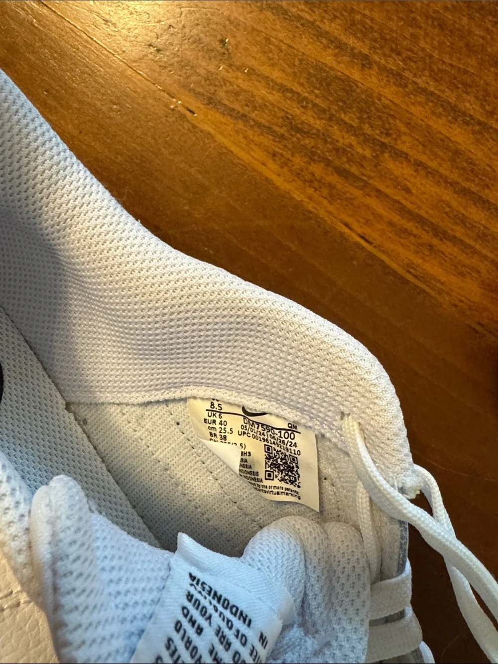 Nike Women’s White Sneakers with Black Swoosh and Tan Stripe